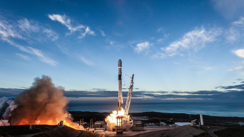 A rocket lifting off from its launch pad.